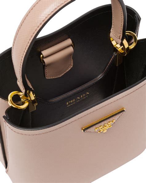 prada tasche beige klein|Prada handbags.